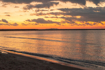 Sunrise view on Levante Beach, Santa Pola, Alicante, Spain, with Tabarca Island on the horizon