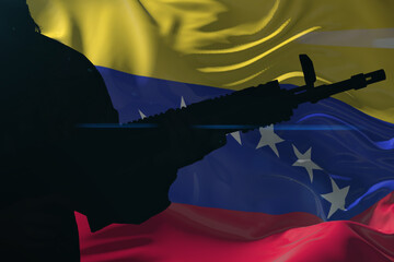 Silhouette of a man with a gun against the background of the national flag of Venezuela.