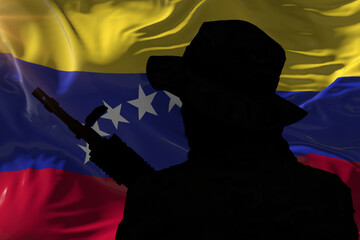 Silhouette of an armed special forces soldier against the background of the flag of Venezuela.