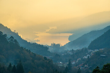 Vila do Geres and the Canicada Dam reservoir in the Peneda-Geres National Park at Sunset. Cavado River. Forest Hills. Portugal. Medium Shot