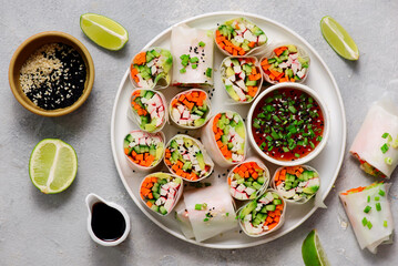 Spring rolls with vegetables, crab sticks and chili sauce