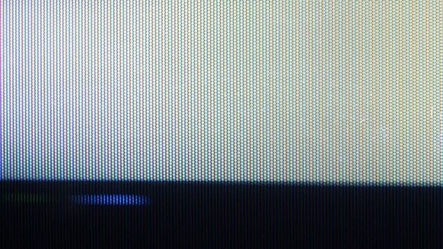 Abstract digital screen animation with visible RGB pixel grid and bright gradient. Loopable video texture inspired by modern display close up, electronic screen surface, and minimal tech motion.