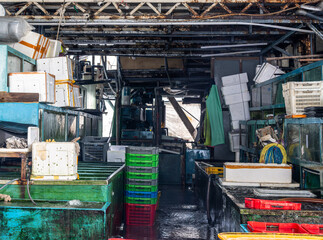 Interior of a seafood wholesale market in Aberdeen, Hong Kong. Industrial working environment at the Aberdeen fish market showing food distribution and logistics.