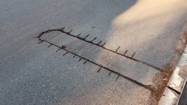 Place of selection of the kernel in the form of a rectangular from asphalt concrete pavement. Kern. Close-up.