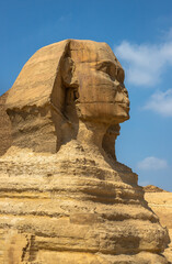 Horizontal view of the Great Sphinx of Giza with a pyramid in the background, Egypt. One of the most iconic ancient monuments, symbol of Egyptian civilization, history and archaeology
