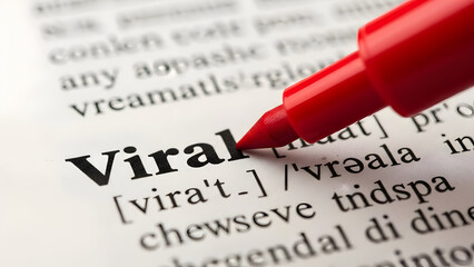 A close-up shot of a dictionary page highlighting the word "Viral" with a red marker, symbolizing online trends and social media reach, ideal for adverti
