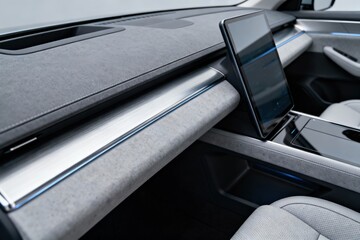 A detailed interior shot showcasing the dashboard with a sleek display and comfortable seating.