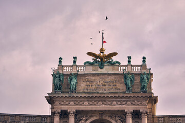 The Imperial Golden Eagle crest and bronze victory statues on th