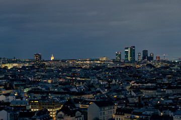 Panoramic view of the illuminated dense skyline of Vienna, Austr