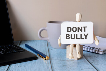 Cyber Bully alphabet letters on wooden background