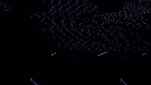 Dark abstract digital particle animation with glowing blue dots forming a futuristic data landscape. Cinematic technology motion background for intro, transition, data, or sci fi visuals.