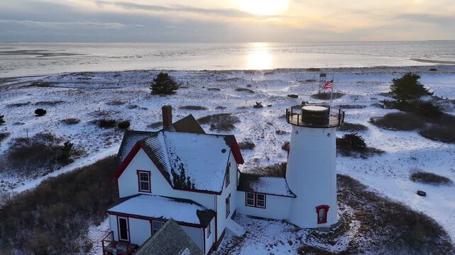 Drone Aerial of Chatham, Cape Cod Coastline and Lighthouse in Winter