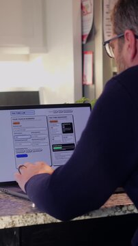 Middle Aged Man Runs Tax Assessment for Home Based Small Business Preparing for Tax Season and Prepayments Concept