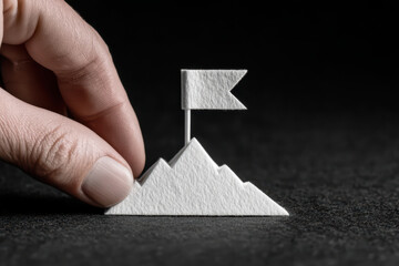 Small mountain white paper finger flag black background texture