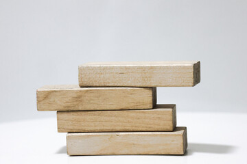 Wood bar pieces with shadows on white background. Climbing horizontal wooden bars as concept of kids development toy, construction or decoration. Mockup stairs or diagram elements