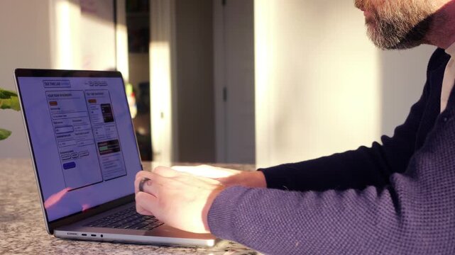 Middle Aged Man Runs Tax Assessment for Home Based Small Business Preparing for Tax Season and Prepayments Concept