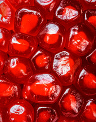 Close up pomegranate seeds showing juicy fruit surface and natural organic texture