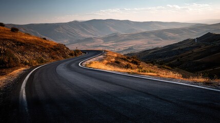 an expansive landscape with a paved road stretching into the distance