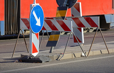 Transport signs on the edge of the pavement in urban city street