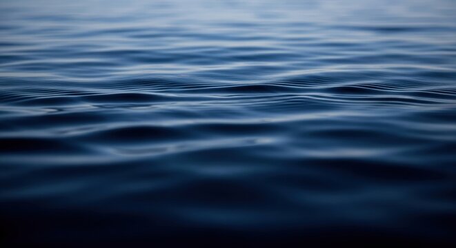 Close up of dark blue water surface with ripples