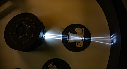 visual demonstration of optics, bright parallel light beams passing through a transparent optical element