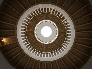 Modern wooden spiral staircase with skylight