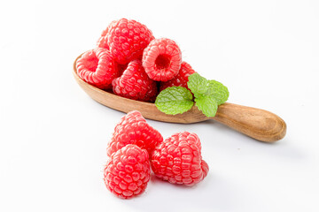 Raspberries Isolated on White Background. Ripe berries in wooden bowl