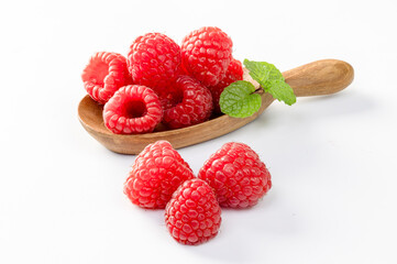 Raspberries Isolated on White Background. Ripe berries in wooden bowl