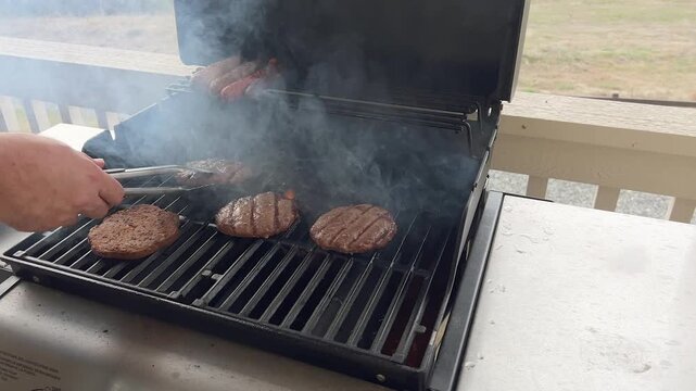 Smoky Grill with Burgers and Sausages Cooking