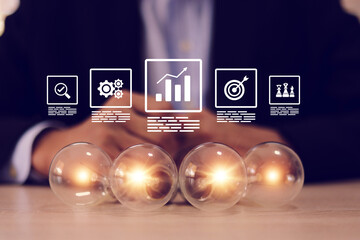 Light bulb with business creativity icons for plan to goal or creative idea innovation or analyzing marketing data management and target growth or human resources.