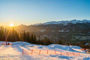 Tatry mountains at sunrise seen from Gubalowka hill in Zakopane. Poland