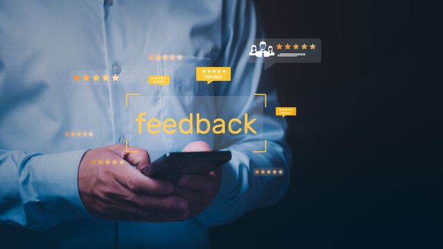 Businessman using a smartphone to provide positive feedback with five-star rating icons, Concept of customer satisfaction, online reputation management, user experience, and digital marketing survey - Powered by Adobe