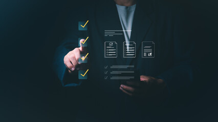 Businessman checking virtual boxes on a digital checklist for quality assurance, project management, and ISO standard compliance, Professional concept for task completion and business auditing.