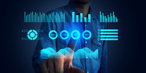 Man interacting with virtual data dashboard and digital analytics interface on blue background for technology, innovation, business analysis, user interaction, and modern UI concepts etc. 