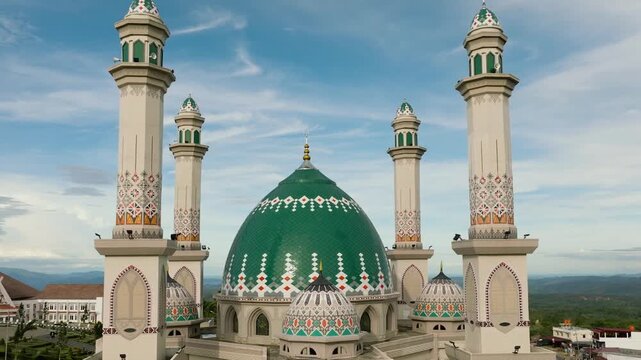 Aerial drone of beautiful mosque with minarets in Asia. Masjid Agung Syahrun Nur Tapanuli Selatan. Sumatra, Indonesia.