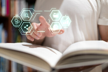 Digital file management concept with virtual folder icons hovering over an open book in a library, representing data organization, archiving document digitization technology.