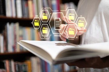 Digital file management concept with virtual folder icons hovering over an open book in a library, representing data organization, archiving document digitization technology.