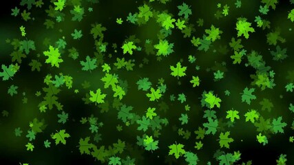 Vibrant green maple leaves scattered across a dark background with a shallow depth of field, conveying a natural and serene mood.