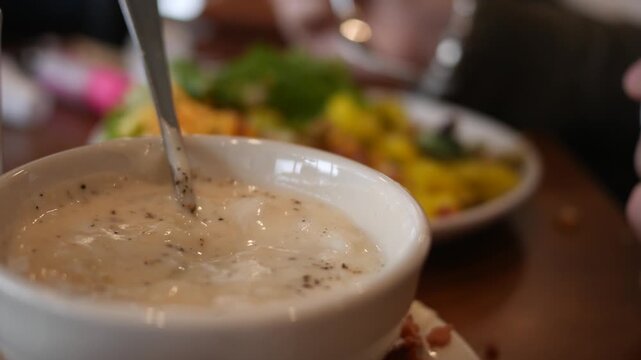 Bowl of Clam Chowder or Potato Soup in Restaurant