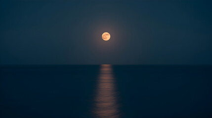 Long Exposure Landscape of Full Moon Reflecting on Calm Dark Blue Ocean Water
