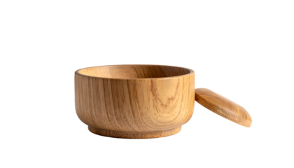 A wooden bowl with a matching lid, set against a stark black background. The natural grain of the wood is prominently visible