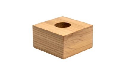 A simple wooden cube with a cylindrical hole in its top surface. The block's grain is visible, and it's isolated on a black background