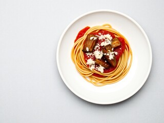 Plate of spaghetti with tomato sauce and mushrooms