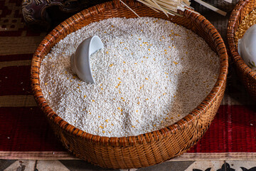 Traditional Vietnamese family hands wrapping Banh Chung with dong leaves, glutinous rice, mung beans, and pork during Lunar New Year preparations. Photo taken in Vietnam on January 17, 2025.