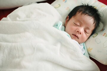 baby sleeping in bed