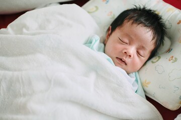 baby sleeping in bed