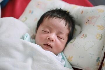 baby sleeping in bed