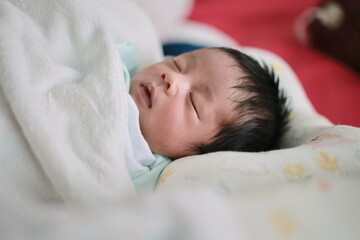 sleeping baby in bed