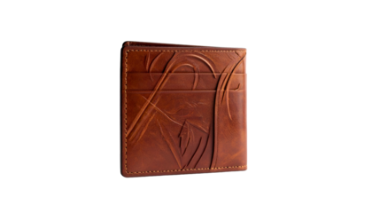 A close-up studio shot of a brown leather bi-fold wallet. The wallet's surface features embossed decorative details. The background is black