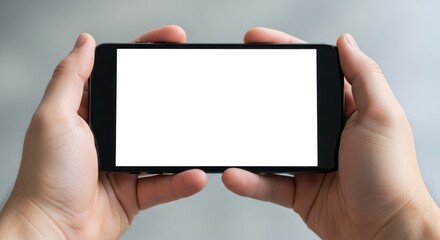 Hands holding a modern smartphone with a blank white screen, ready for content insertion
